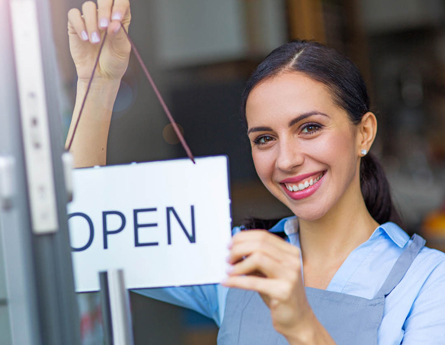 Business owner opening her store