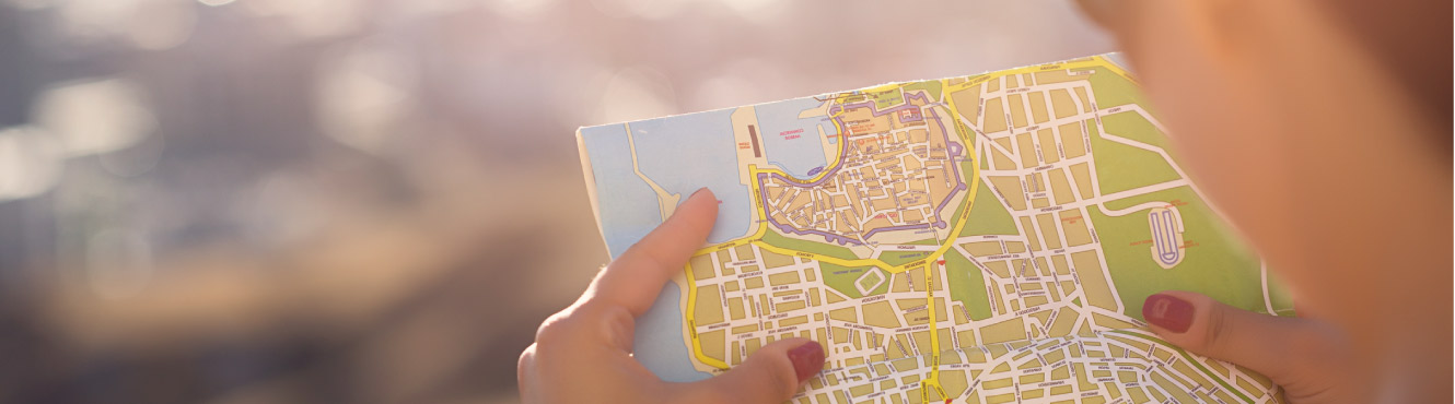 A woman holds a map