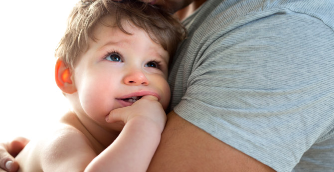 Father holding his baby boy in his arms