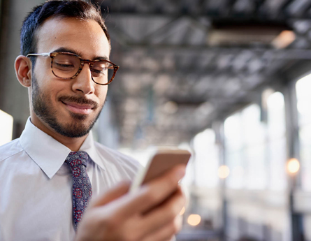 smiling guy on mobile phone 