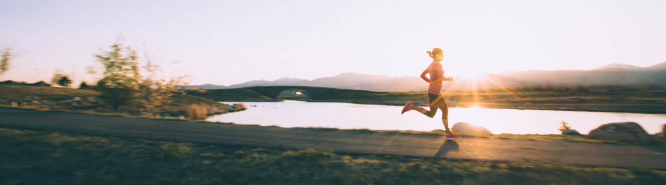 A woman runner at sunset