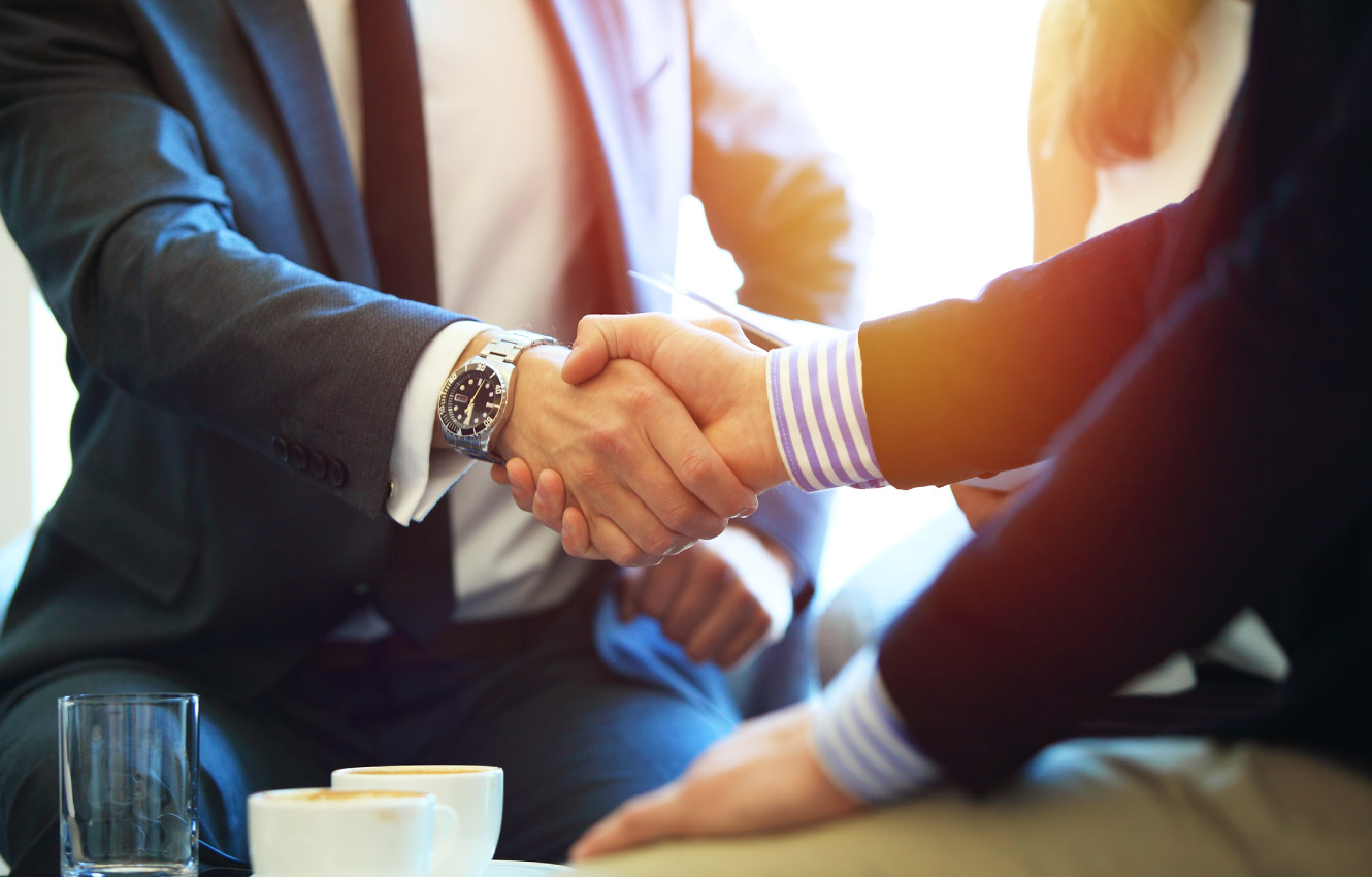 Two business men shaking hands