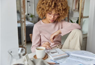Woman calculating and budgeting her loan