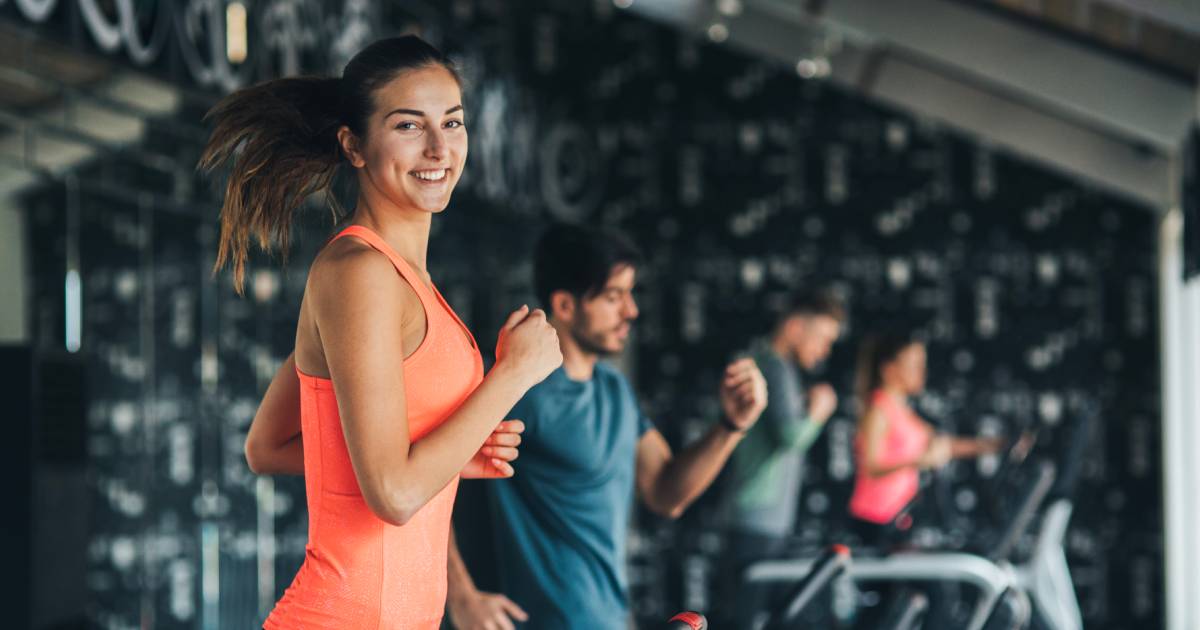 Woman running on treadmill in gym