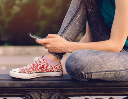 Young adult on her mobile phone