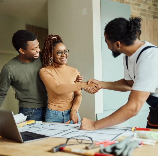 Couple working with a contractor for home renovations