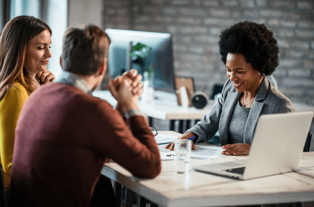 Couple talking about retirement with financial advisor