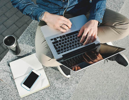 College student with lap top in lap.