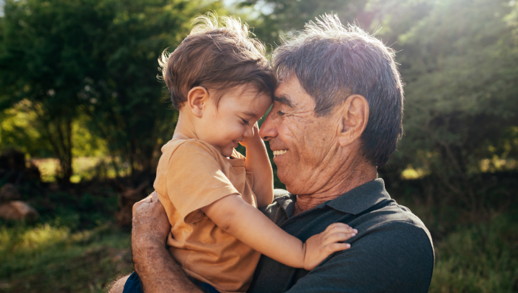 Grandfather and grandson smiling