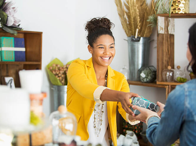 Shop owner serving customer