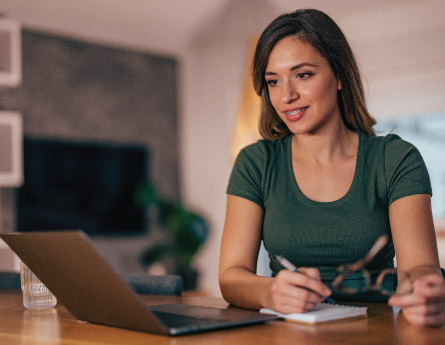 Person reviewing their credit report and credit score on their laptop.