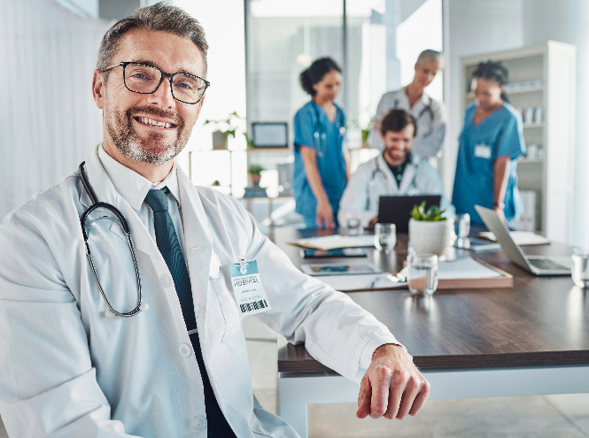 Doctors in a room discussing an equipment leasing plan