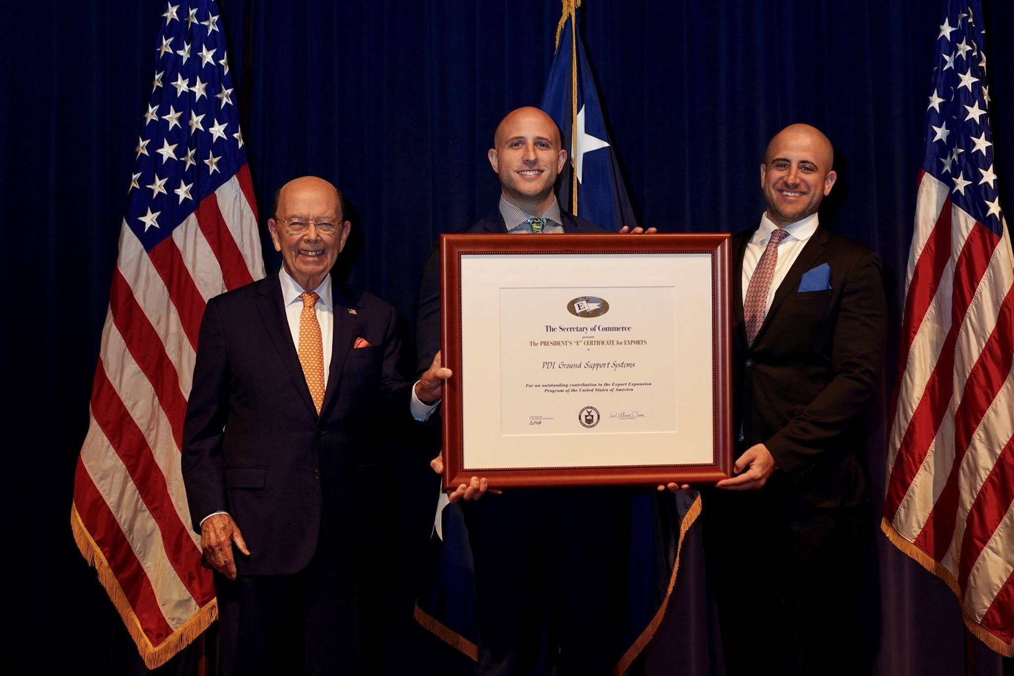 Nathan Haber (R) and Ryan Haber (M) accepting the Presidential "E Award" for Export Excellence from Secretary of Commerce, Wilbur Ross.