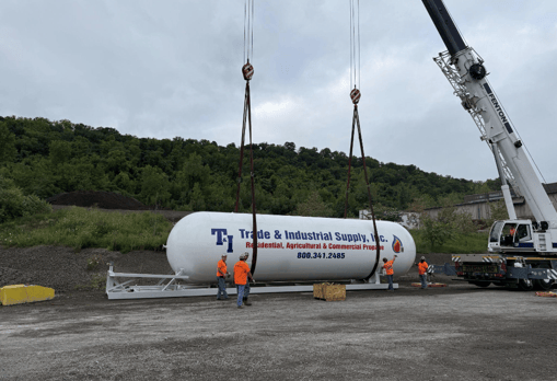crew works on propane tank