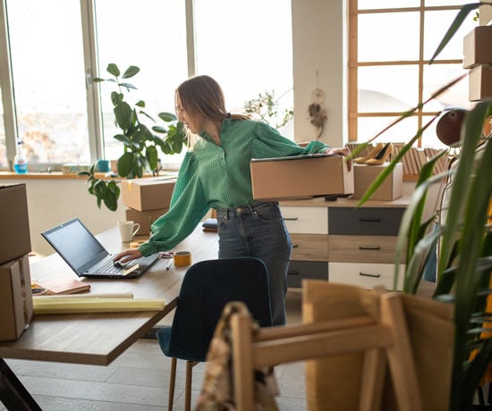 Woman managing side hustle business with packages