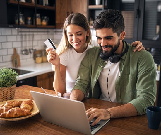 Couple with computer shopping online