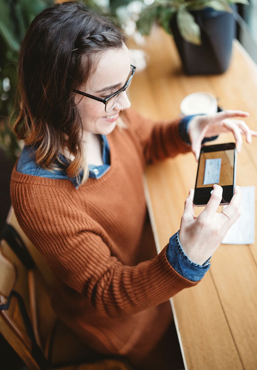 Woman using mobile check deposit