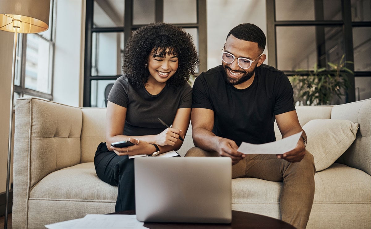 Couple working on computer together