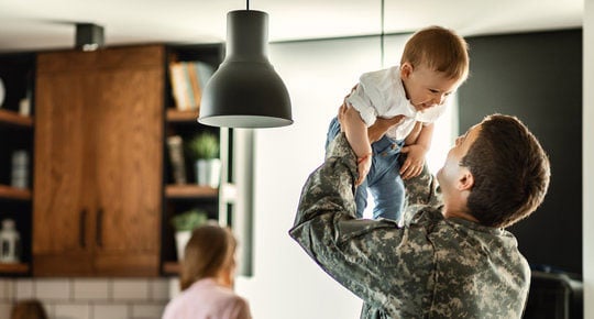 Military man with child