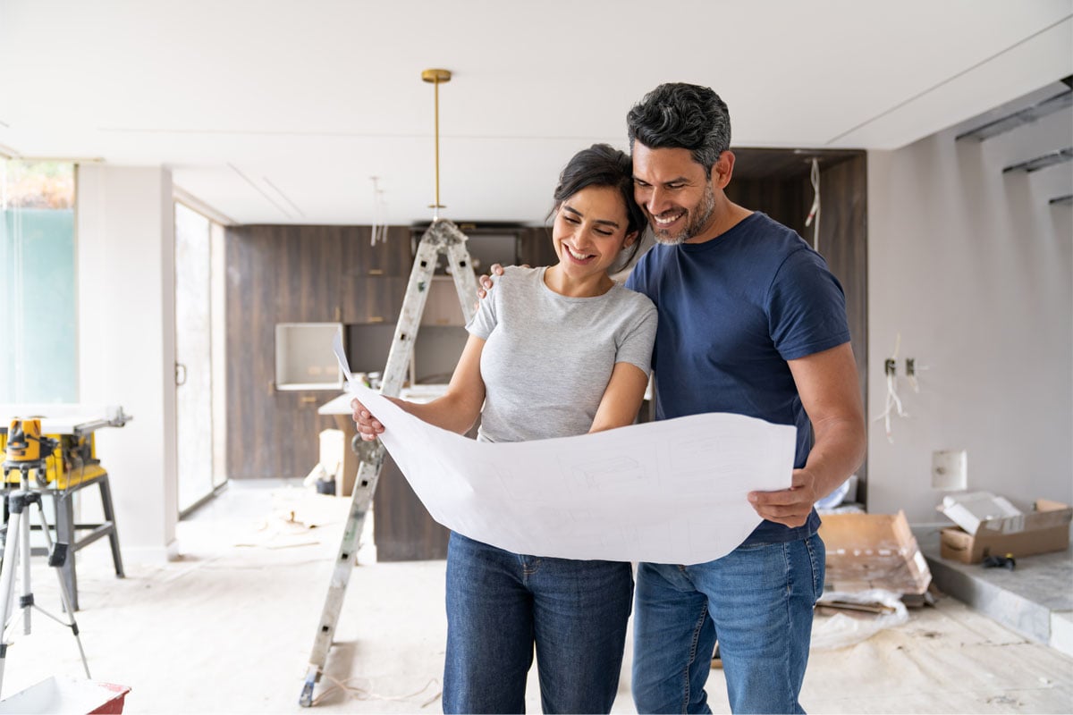 Couple looking at building plans