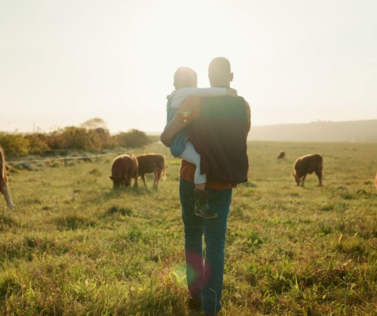 Farmer and child in field