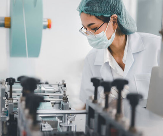 Asian female doctor using lab equipment