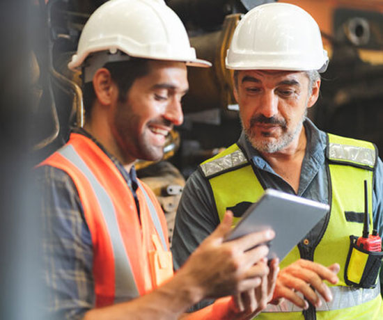Professional technicians in hard hats