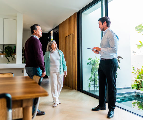 Mature couple looking for a new home with a realtor