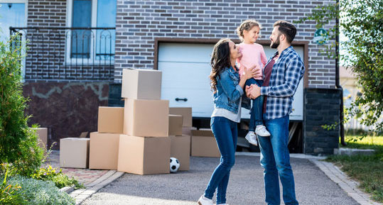 Family in front of new home