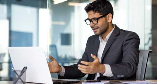 Business professional concerned over computer