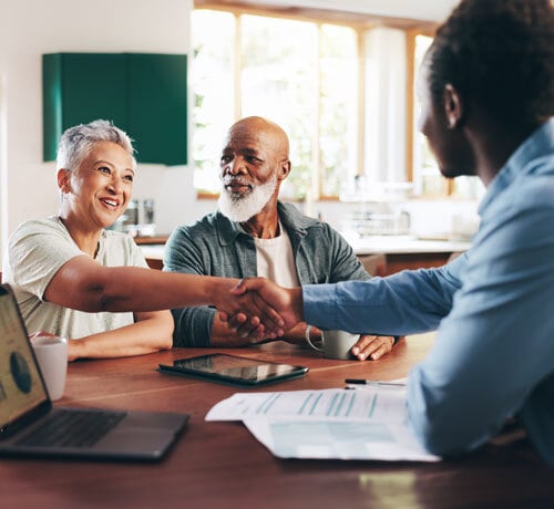 Black couple meeting with financial advisor
